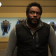 Fred Johnson (Chad Coleman) and his helmet art wall.